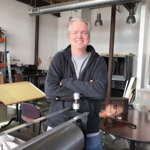 Silver can of relief ink with a skull on the label.