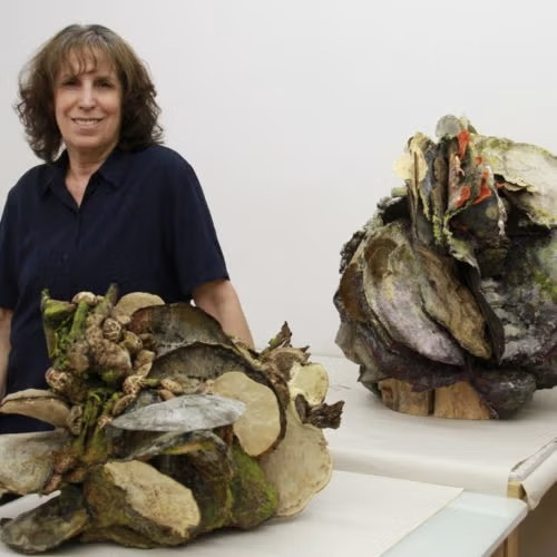 Jar of intaglio printmaking ink that's Diarylide Yellow with a white label and cap.