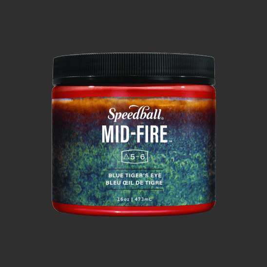 Jar of red glaze with a label that has an image of the glaze fired which is blue and green mottling fading to amber at the top.
