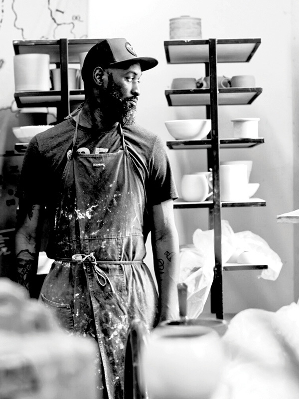 Four brightly colored Boss Base tools in green, blue, orange and red.