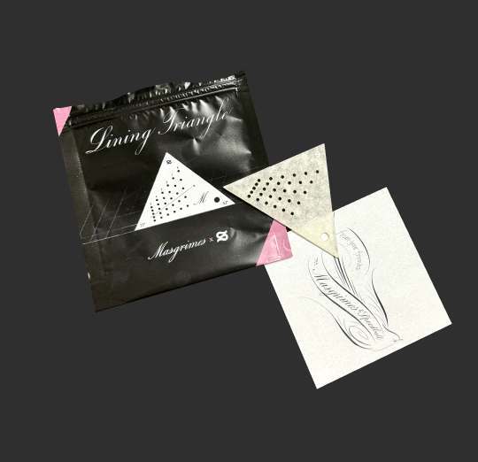 Pink and black open pouch with a lining triangle and a thank you postcard.